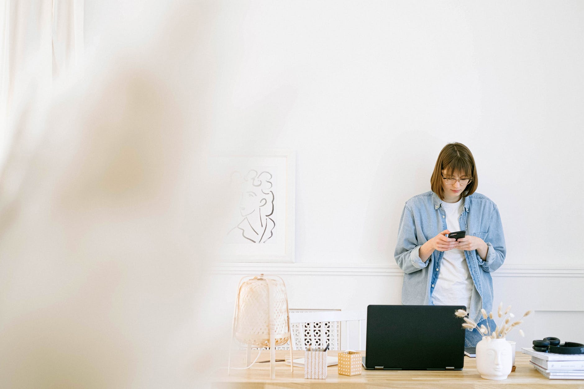 Woman with computer and phone